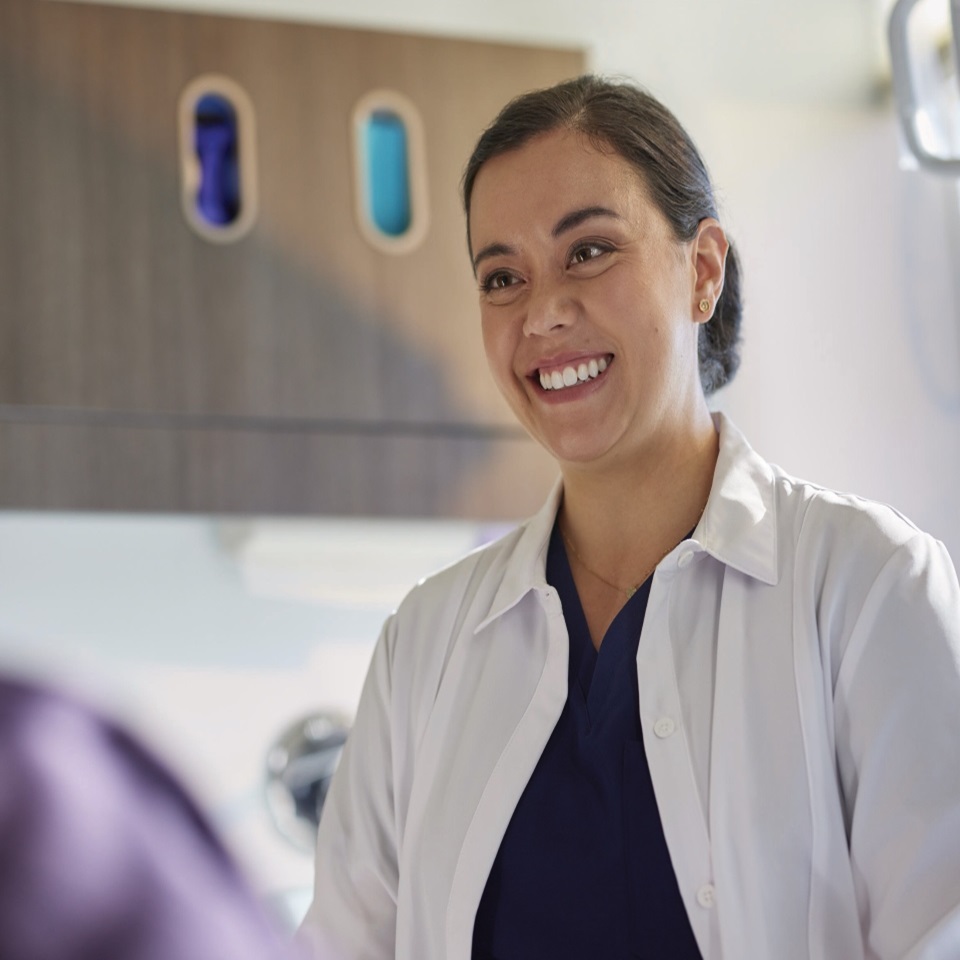 Hygienist speakign with patient